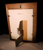 The rear of the frame showing the keyhole hanger and card stand