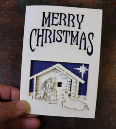 Multi-layered laser cut Christmas card with nativity scene
