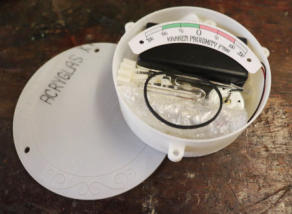 An open unassembled gauge kit showing all the parts inside