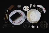 The 29 kit parts arranged nicely on a black background