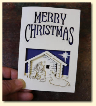 Multi-layered laser cut Christmas card with nativity scene