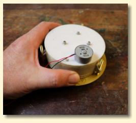 The back of the assembled gauge showing the motor and glued in axles