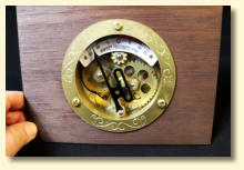 The gauge mounted in a wooden panel