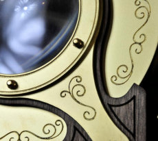Weather scene viewing lens with engraved details