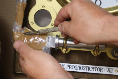10) Carefully cut the brown tape holding the bubble wrap onto the bellows - don�t cut too deep
