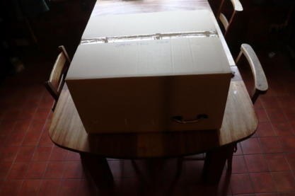 6) So sit the box on a table, perhaps with a protective towel or newspaper underneath