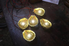 Five illuminated miniature shell lamps showing the LEDs