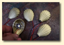 Five of the 3D printed brass coloured LED shell lamps