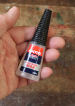 I'd suggest using Superglue to stick the plastic parts together, although you could use an aletrnative adhesive of your choice.