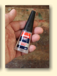I'd suggest using Superglue to stick the plastic parts together, although you could use an aletrnative adhesive of your choice.