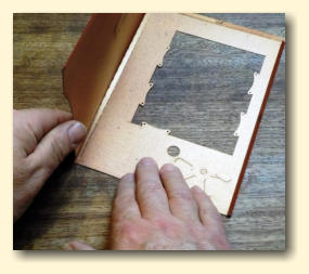 Get ready to fold the pocket cutout in half