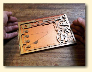 Gently lower the cutout onto the foam pads checking that the corners line up