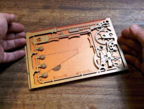 Gently lower the cutout onto the foam pads checking that the corners line up