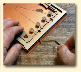 Peel the backing from the tape on the flap