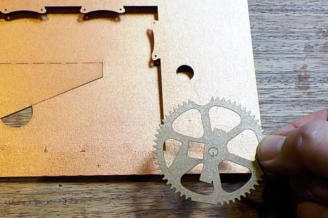 Line up the gear with the hole and markings