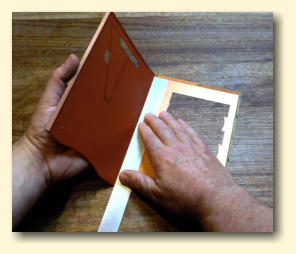 Carefully use the ruler to fold over each of the middle folds