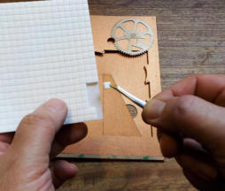 Use tweezers to peel off each foam pad