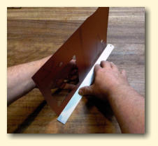 Fold it upwards until vertical