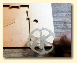 Line up the gear with the hole and markings