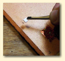 Carefully place a foam pad over each cross