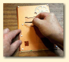 Peel the backing tape off each foam pad
