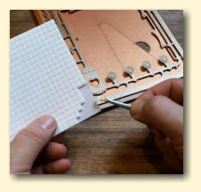 Use the tweezers to peel off the foam pads