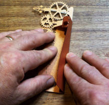 Run your fingers along the fold to ensure its equal all the way along