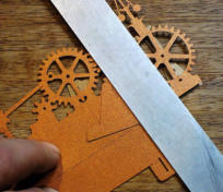Line up a ruler with the fold marks on the support