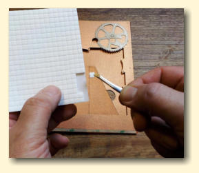 Use tweezers to peel off each foam pad