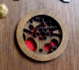 The intricate laser cut air inlet and red filter fabric