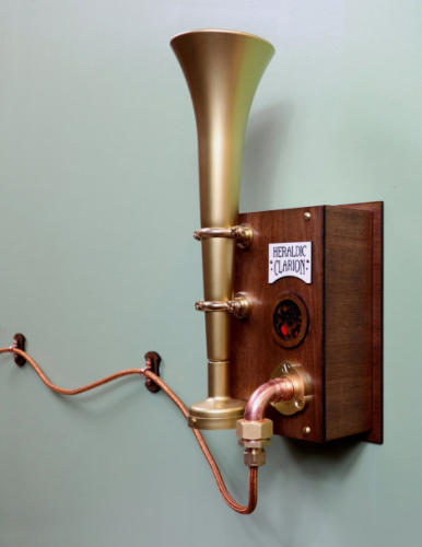 The Heraldic Clarion steampunk door horn with ornate cable supports