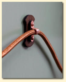 One of the handmade copper and wood Heraldic Clarion cable supports