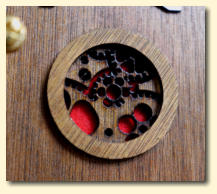 The intricate laser cut air inlet and red filter fabric