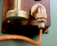 The copper coloured cable entering the Heraldic Clarion door horn through copper and brass fittings