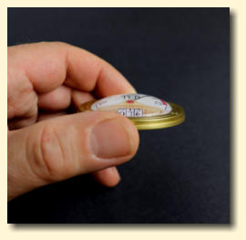 A 50mm diameter decorative gauge showing the lens and image distortion